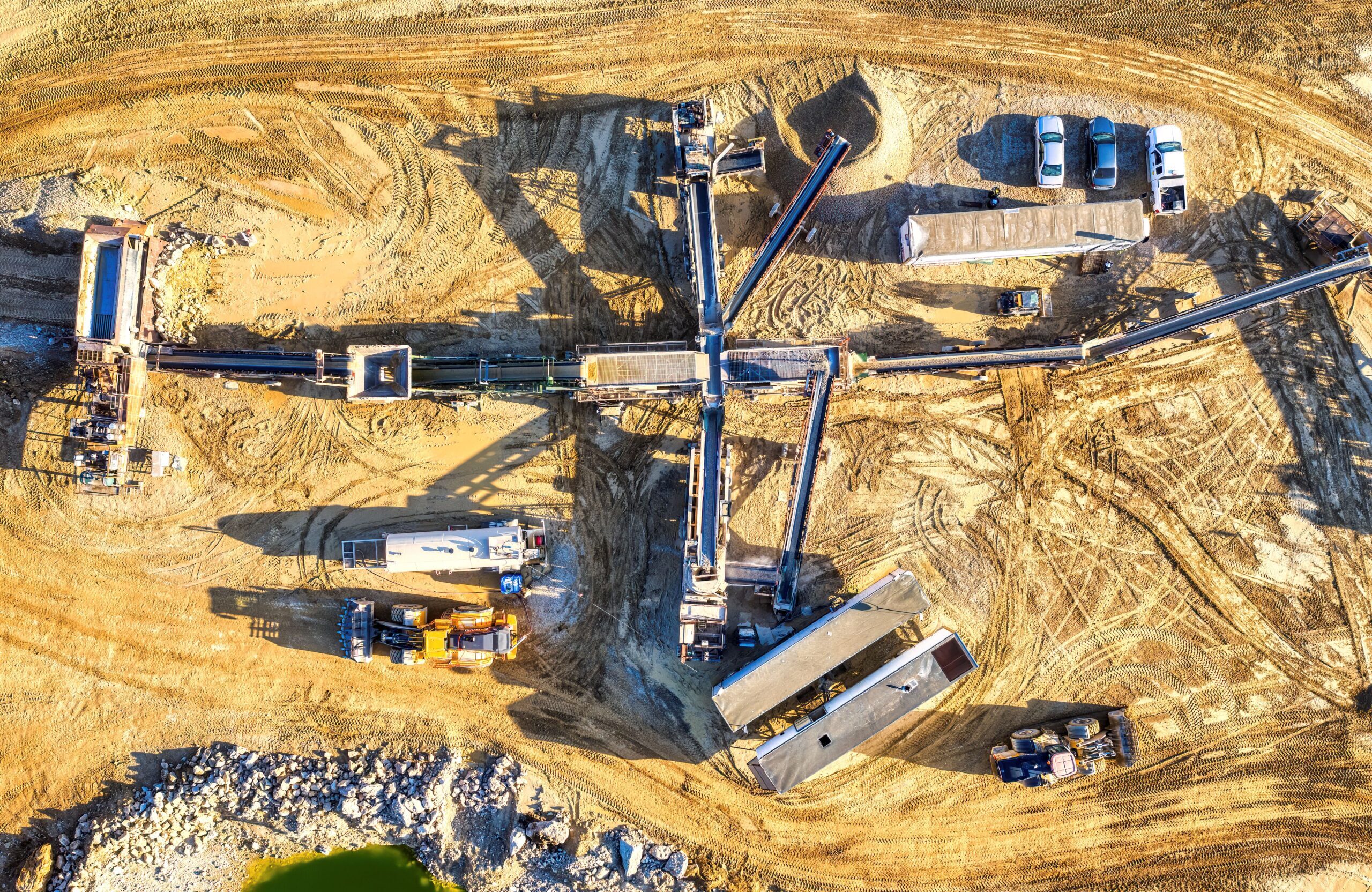 Drone capture of an industrial mining site in Rochester, showcasing heavy machinery and equipment.